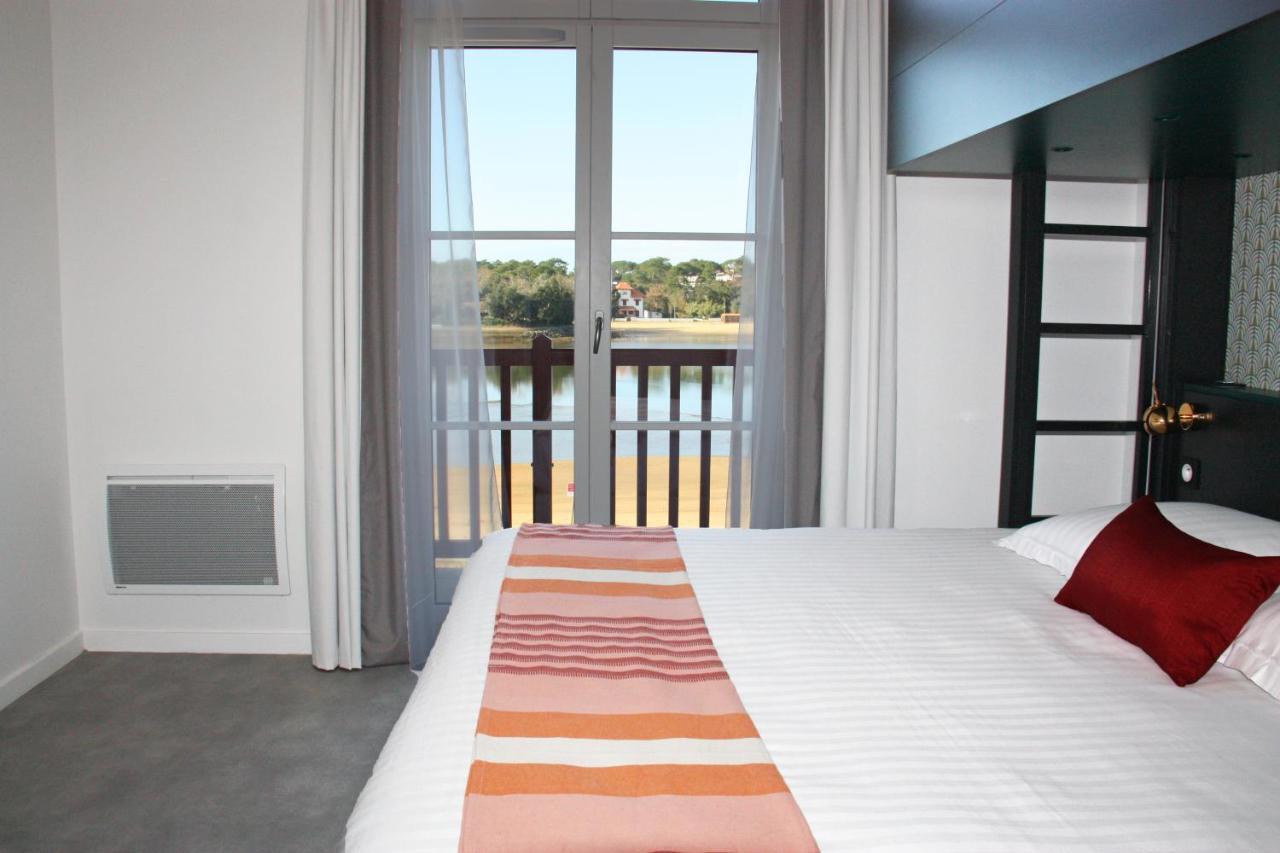 Habitación Doble con litera y vistas al lago