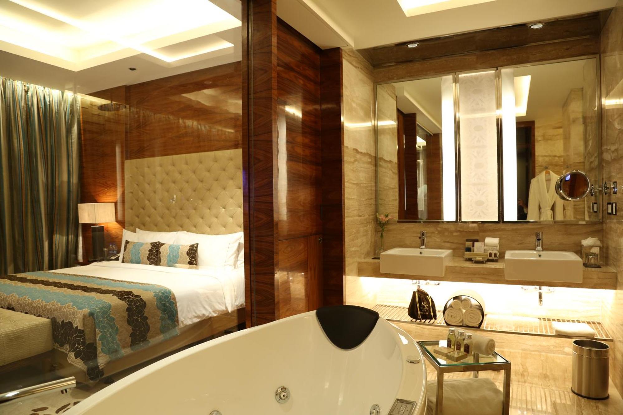 Presidential Suite with One way airport transfers by Luxury Sedan , In - room Breakfast, Butler Service,  02 Pcs of Ironing per day, Complimentary Minibar,20% disc on FNSB, Laundry, transport, Lounge Access with Cocktail hours from 18:00 - 20:00 Hrs,
