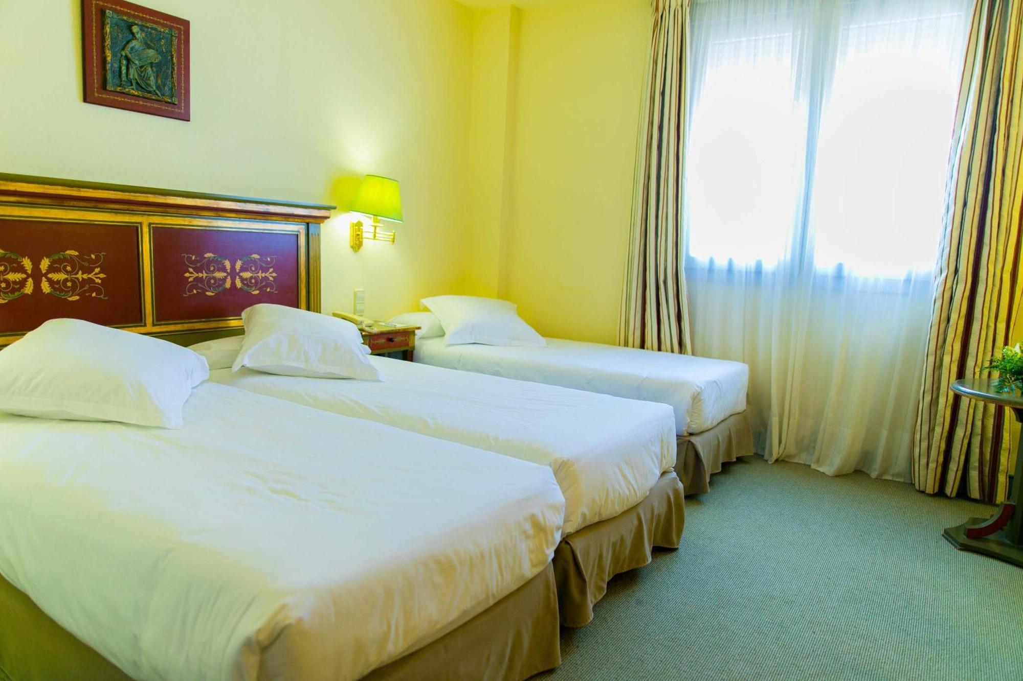 Triple Room (2 Adults + 1 Child)