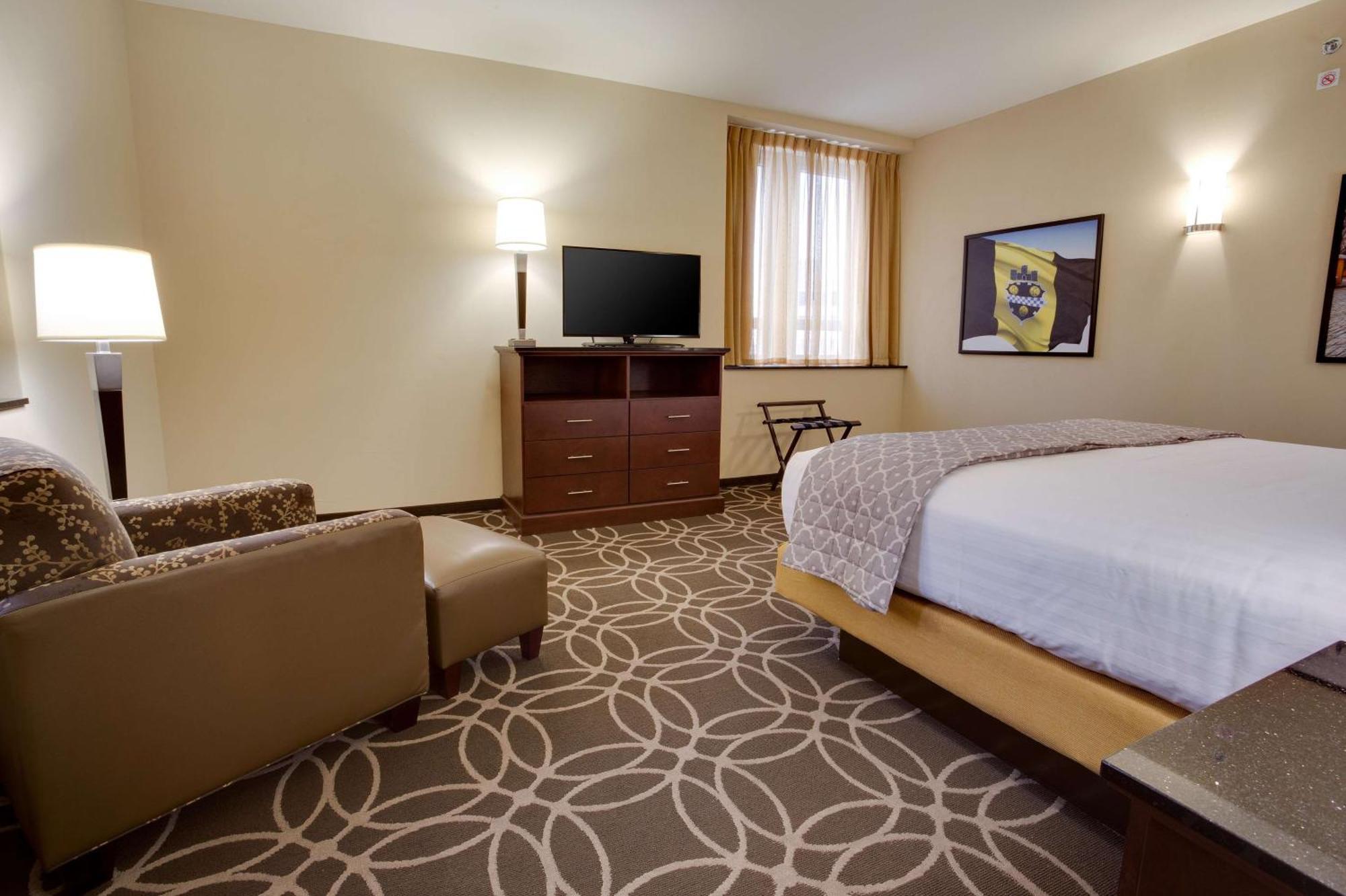 Suite Deluxe con cama extragrande y sofá cama