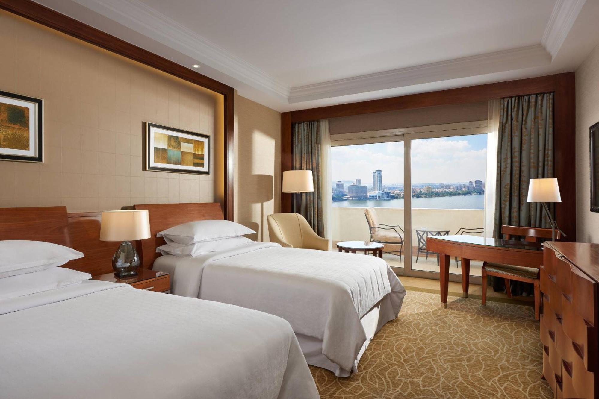 Premium Twin Room with Balcony and Partial River View,1553750908:JPEG