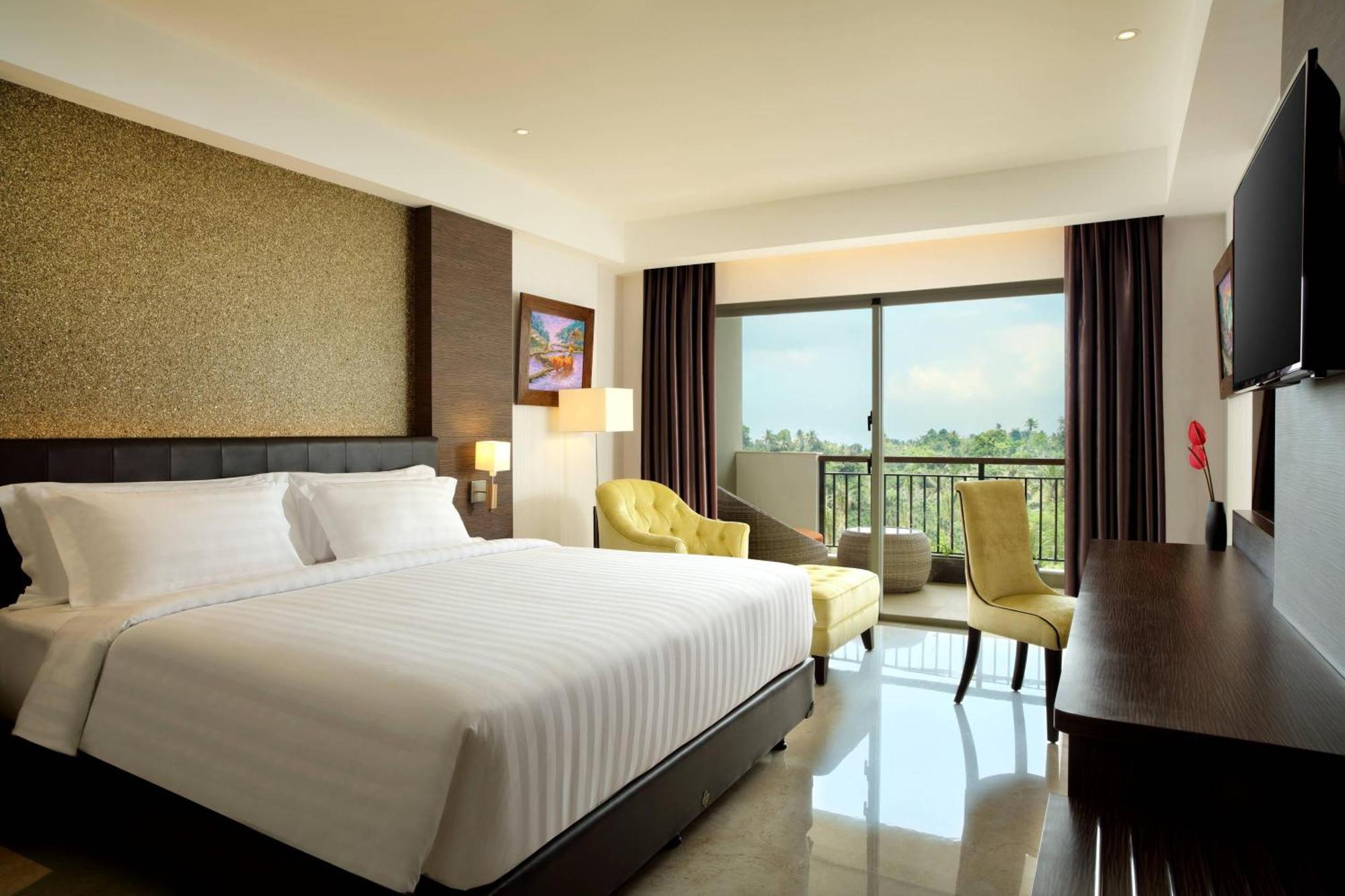 Deluxe King Balcony Room with Pool View, with FREE daily shuttle to Ubud City, FREE Photo Session, FREE Art Gallery Visit, 24-hour access to Fitness Center, FREE Welcome Drink, and FREE Kids Activities.