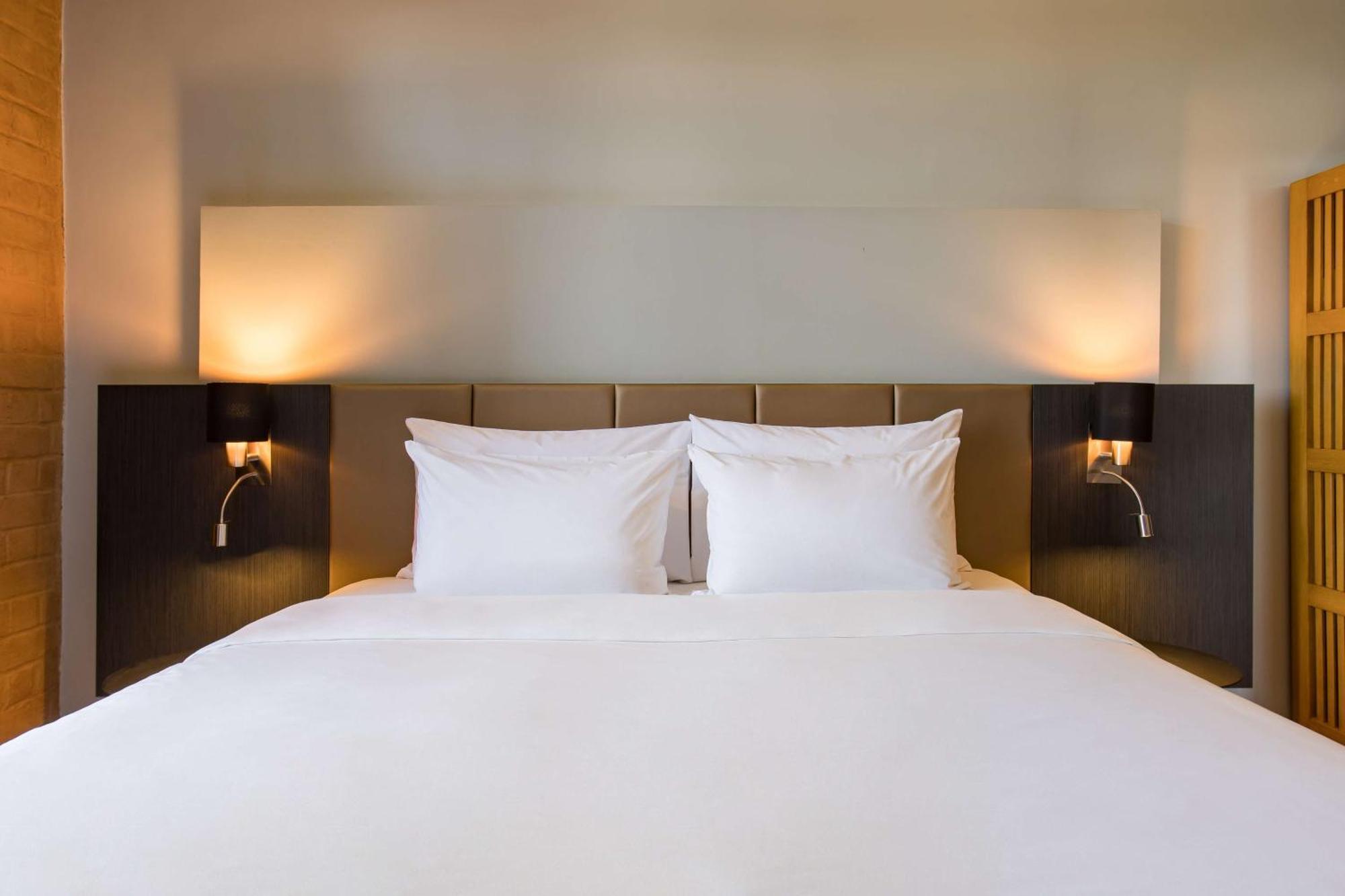 Business Class with Happy Hours 01:00 PM to 06:00 PM 1+1 , Airport Transfers and Free Pick up and drop to Worldmark Aerocity (subject to car availability)