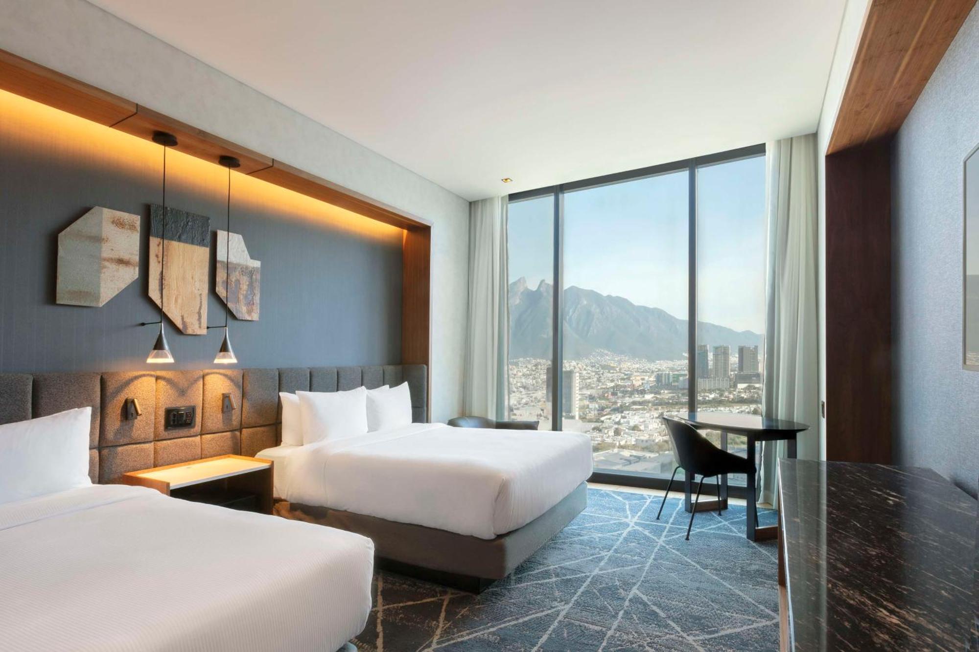 Deluxe Queen Room with Two Queen Beds and Mountain View