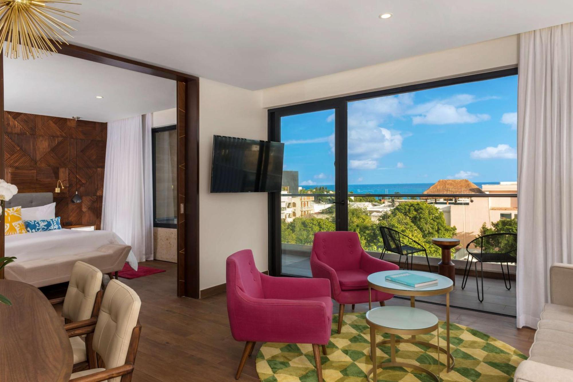 Suite mit 1 Schlafzimmer, Kingsize-Bett und seitlichem Meerblick