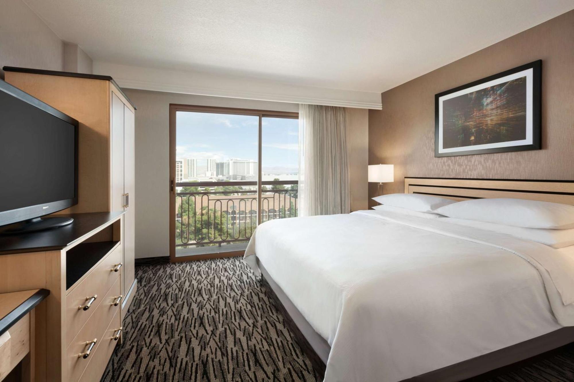 Suite de 2 dormitorios con balcón y cama extragrande