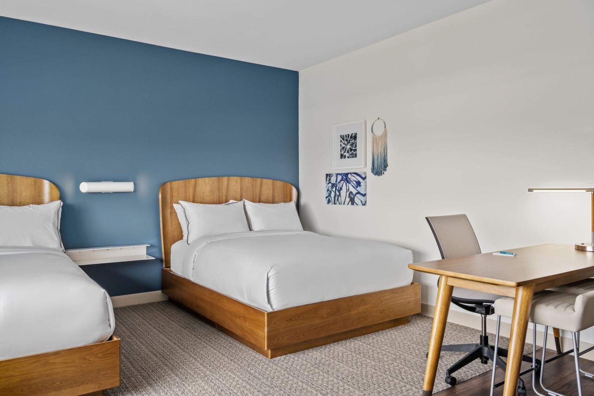 Queen Studio with Two Queen Beds and Sofa Bed - Courtyard View