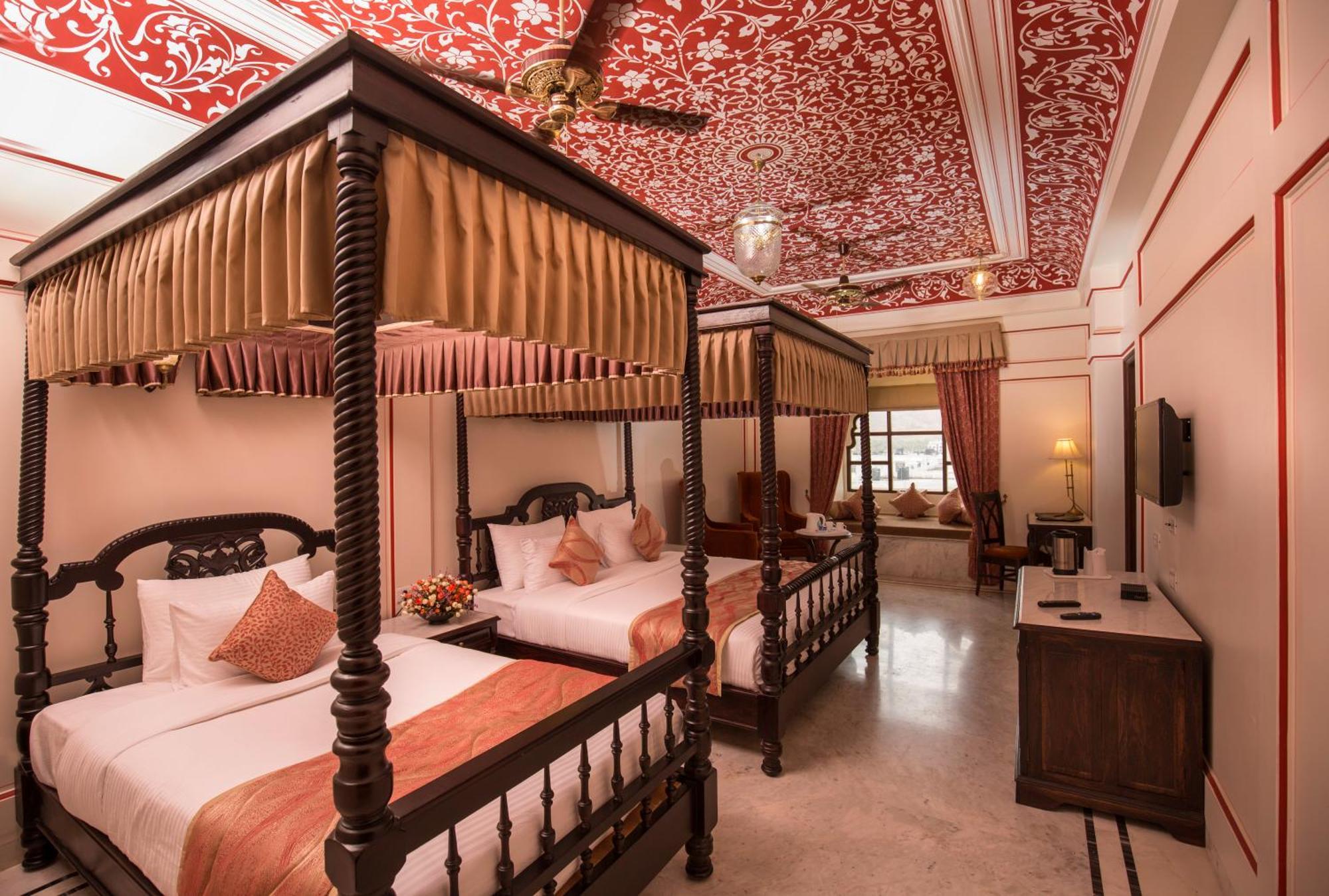 Royal Suite -Enjoy 20% off on spa services. Experience a daily Rajasthani dance & music show from 7–9 PM, complimentary use of two swimming pools, free access to the game room & gym, kids stay complimentary, and a travel desk for local tours & activi