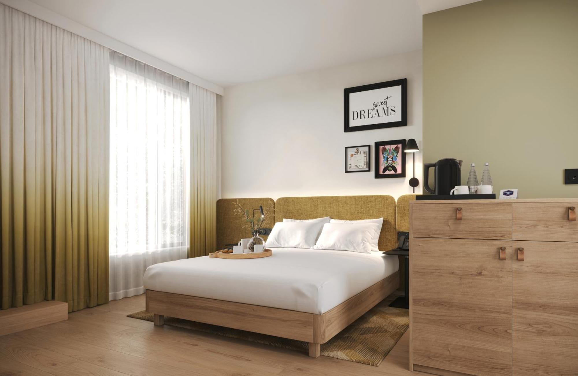 Chambre Lit Queen-Size Accessible aux Personnes à Mobilité Réduite