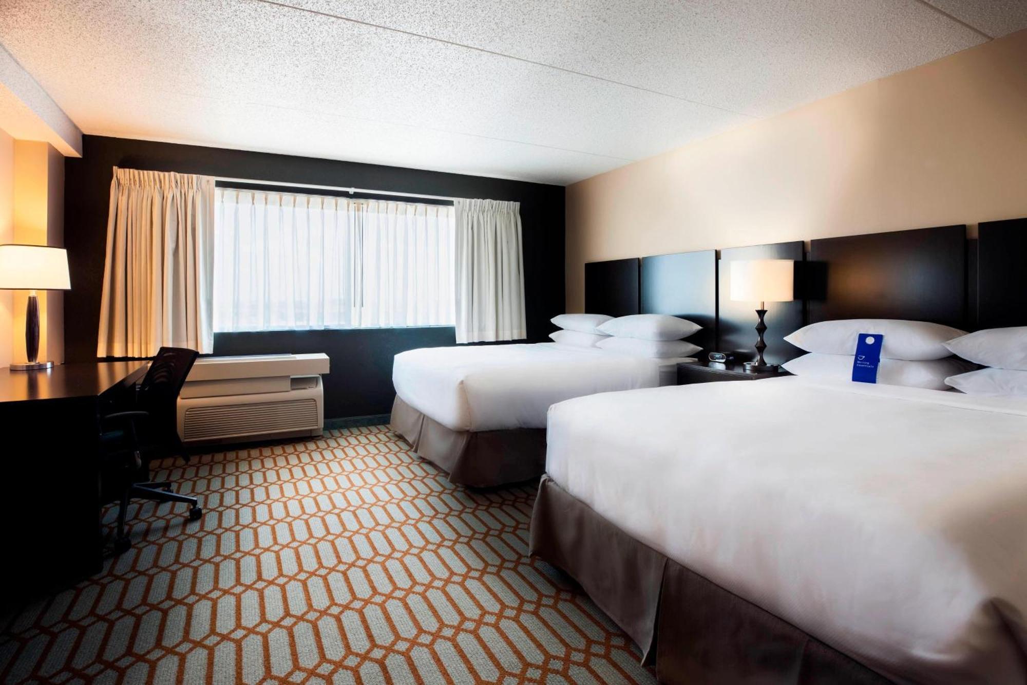 Guest Room Two Queen Beds One Sofa Bed Pool View