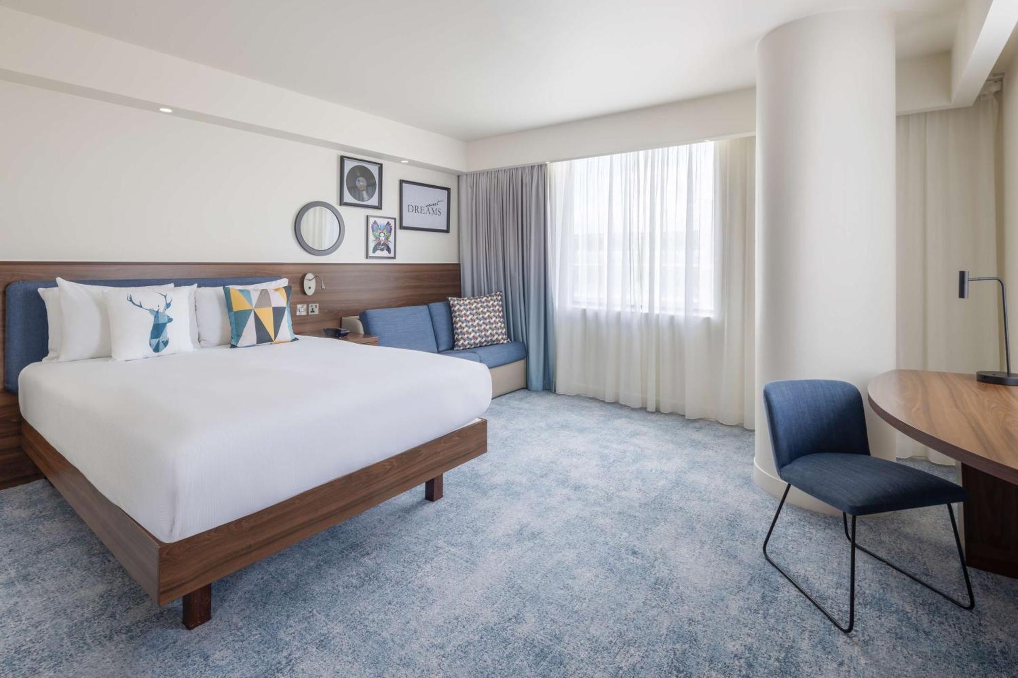 Corner Queen Room with Sofa Bed