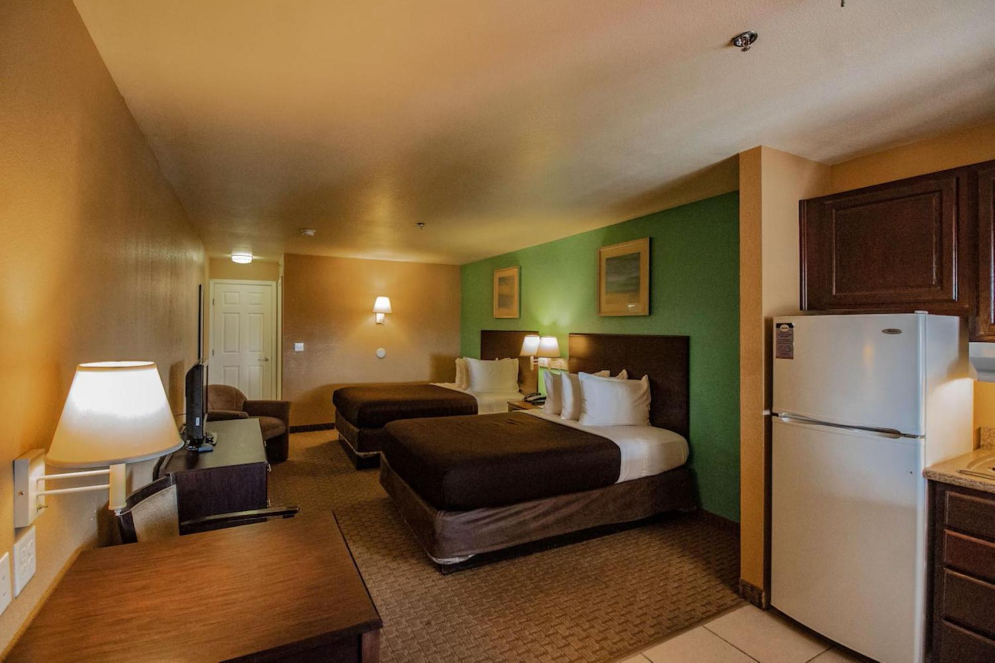 Efficiency Quadruple Room with Two Queen Beds - Non Smoking