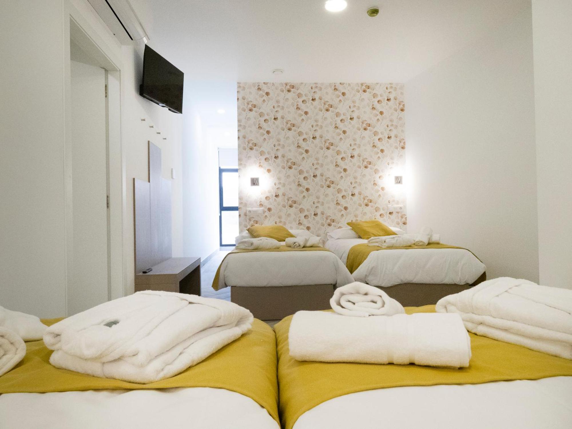 Habitación Cuádruple con baño y acceso al spa