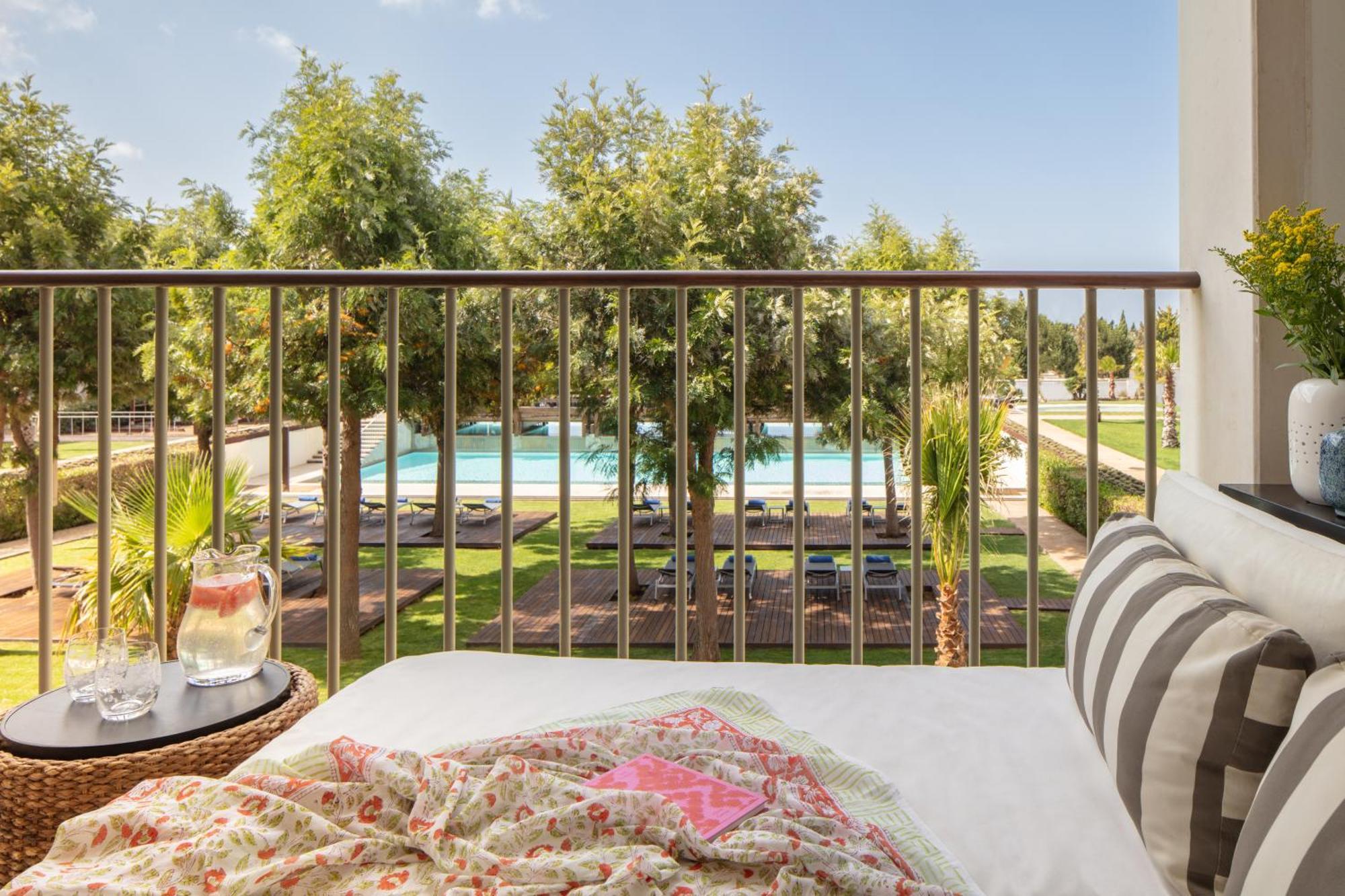 Deluxe King Room with balcony and pool view