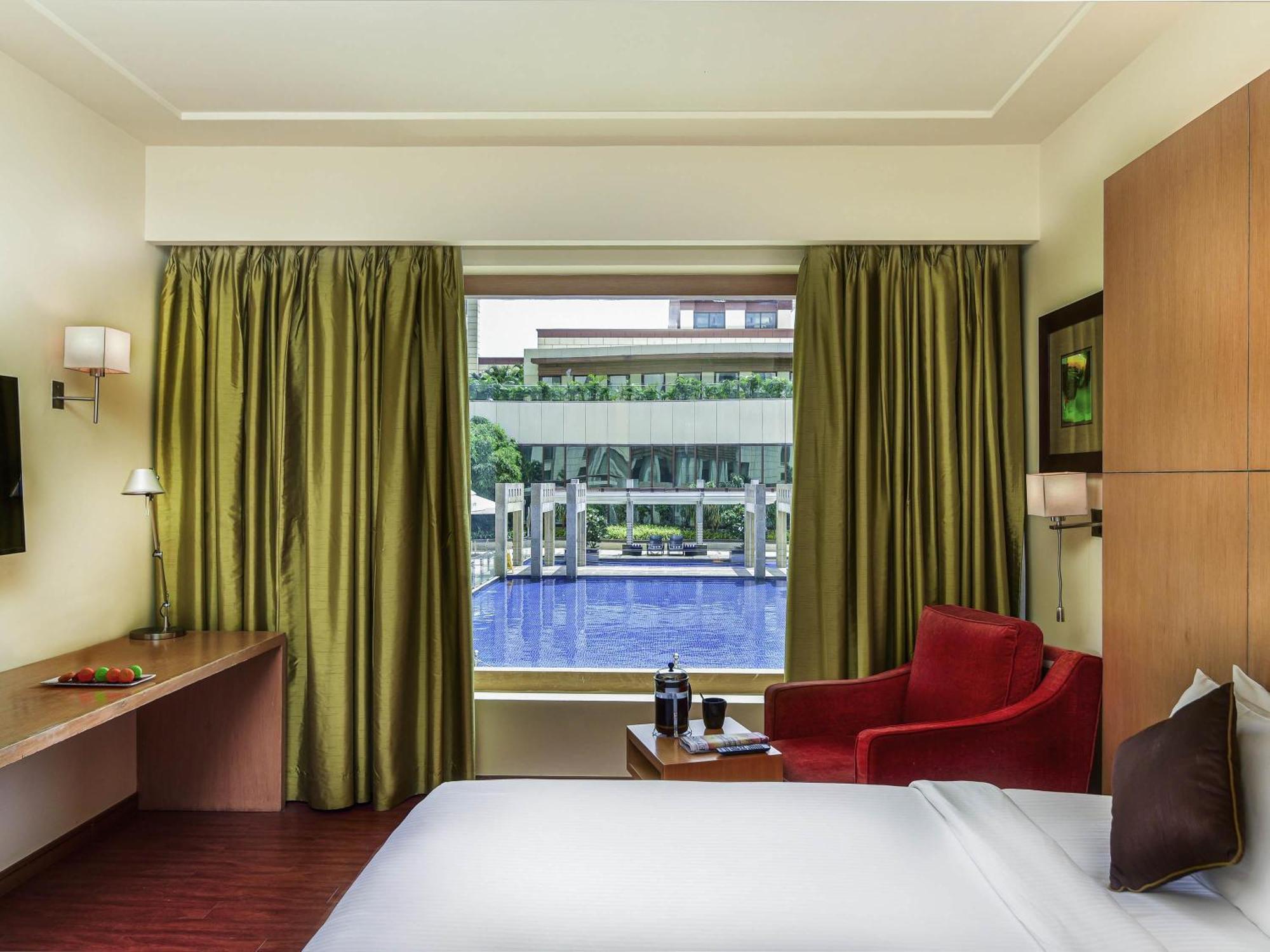Premier King Bed with Pool View and Lounge Access - Happy Hours 6:30 PM to 8:30 PM