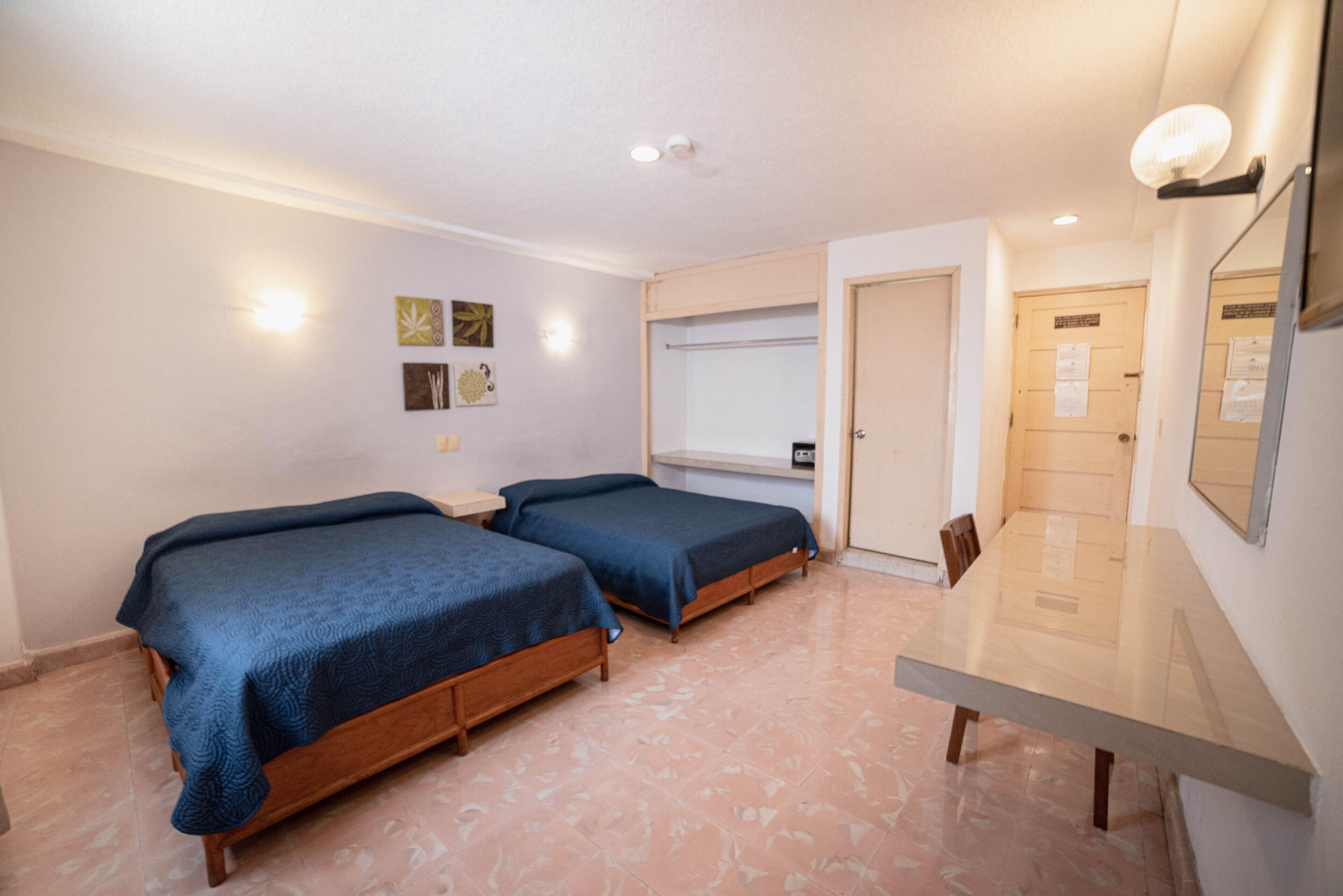 Habitación Doble (3 adultos) - 2 camas dobles