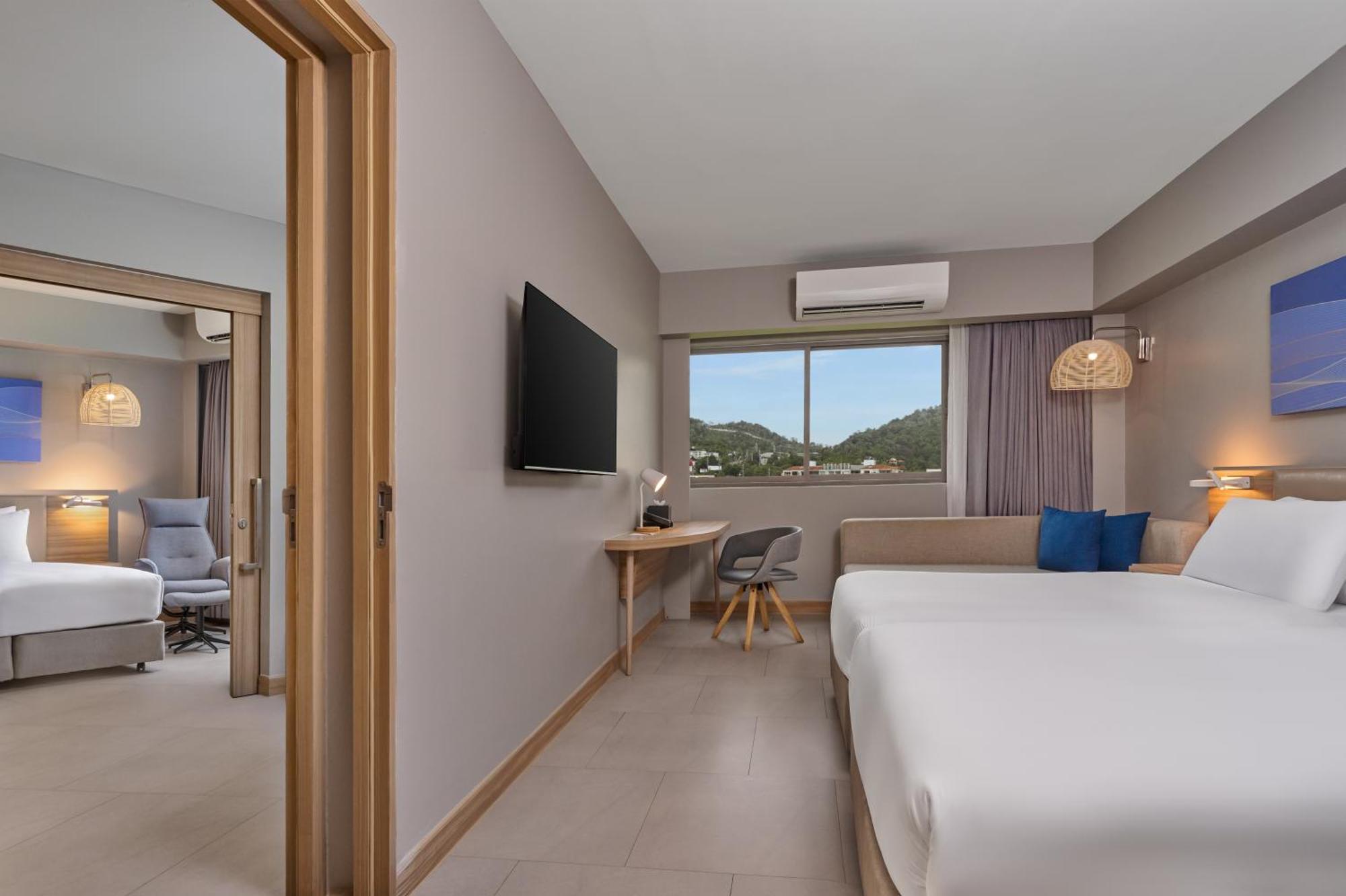 Two-Bedroom Suite with One Double and Two Single Beds