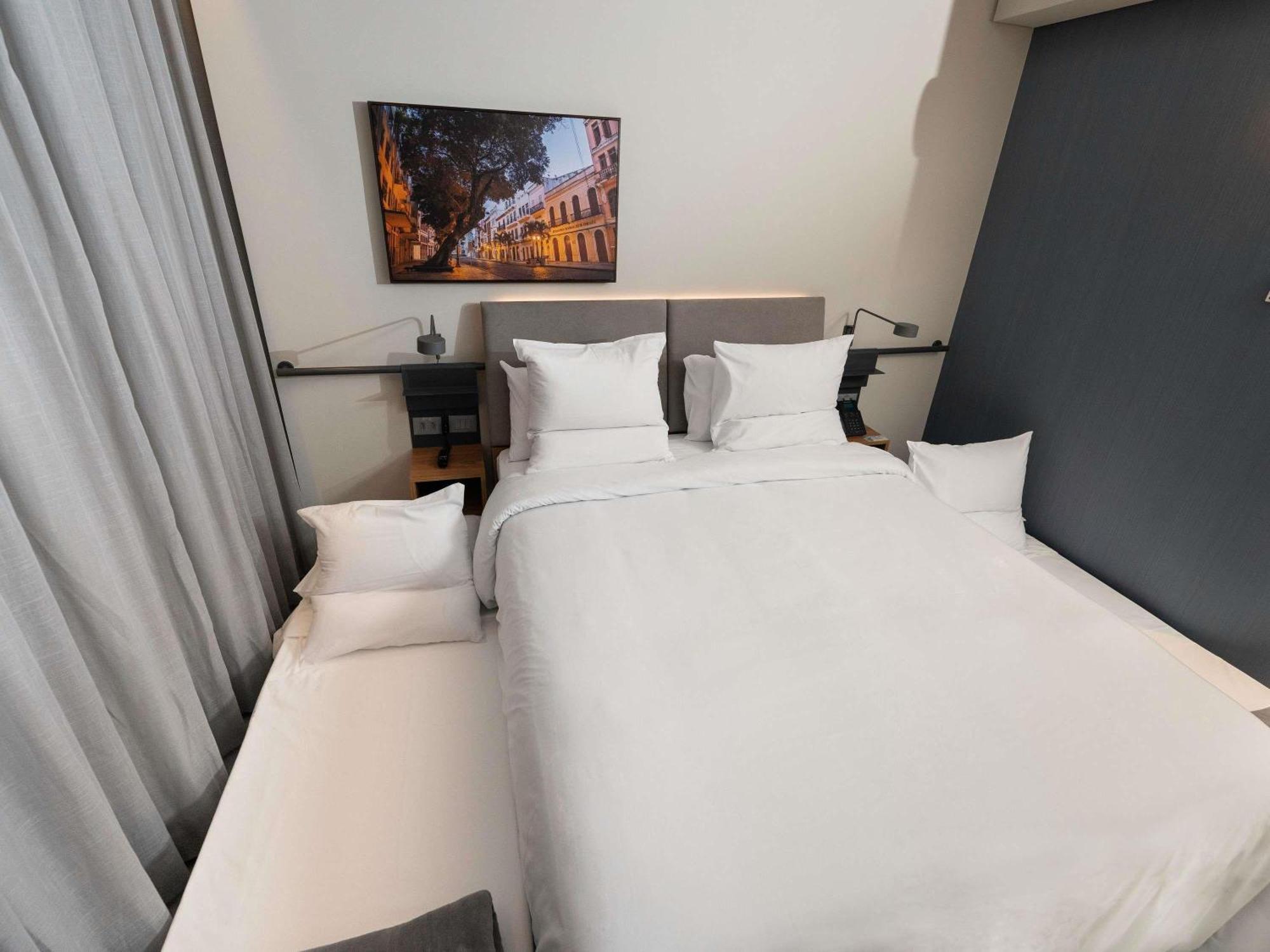 Apartamento família com cama queen-size e cama retrátil