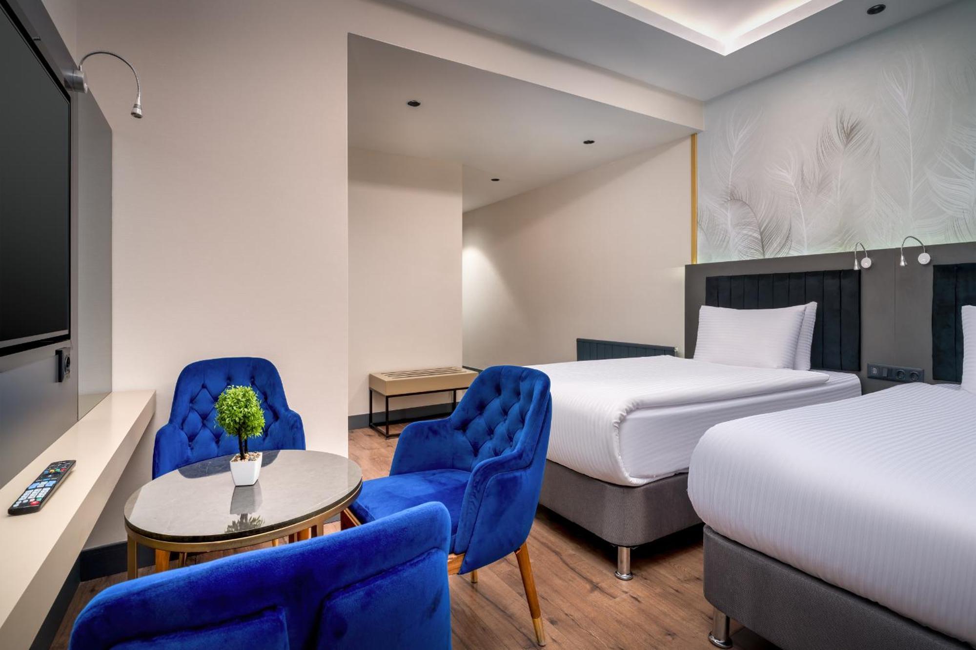 Deluxe Room with One Double and Two Single Beds - Non-Smoking