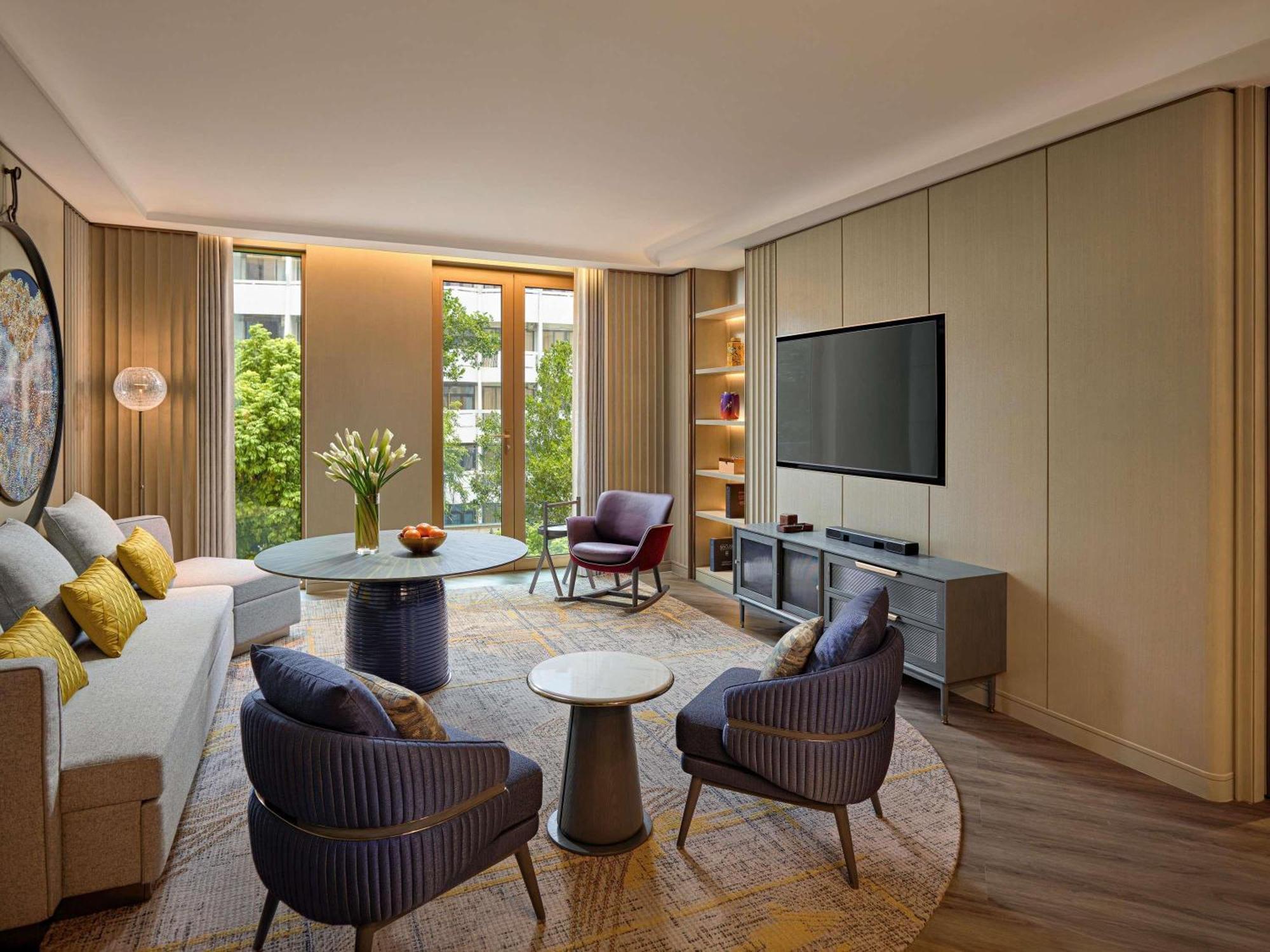 Two-Bedroom Premier Suite King and Two Single Beds - Separate Living Space
