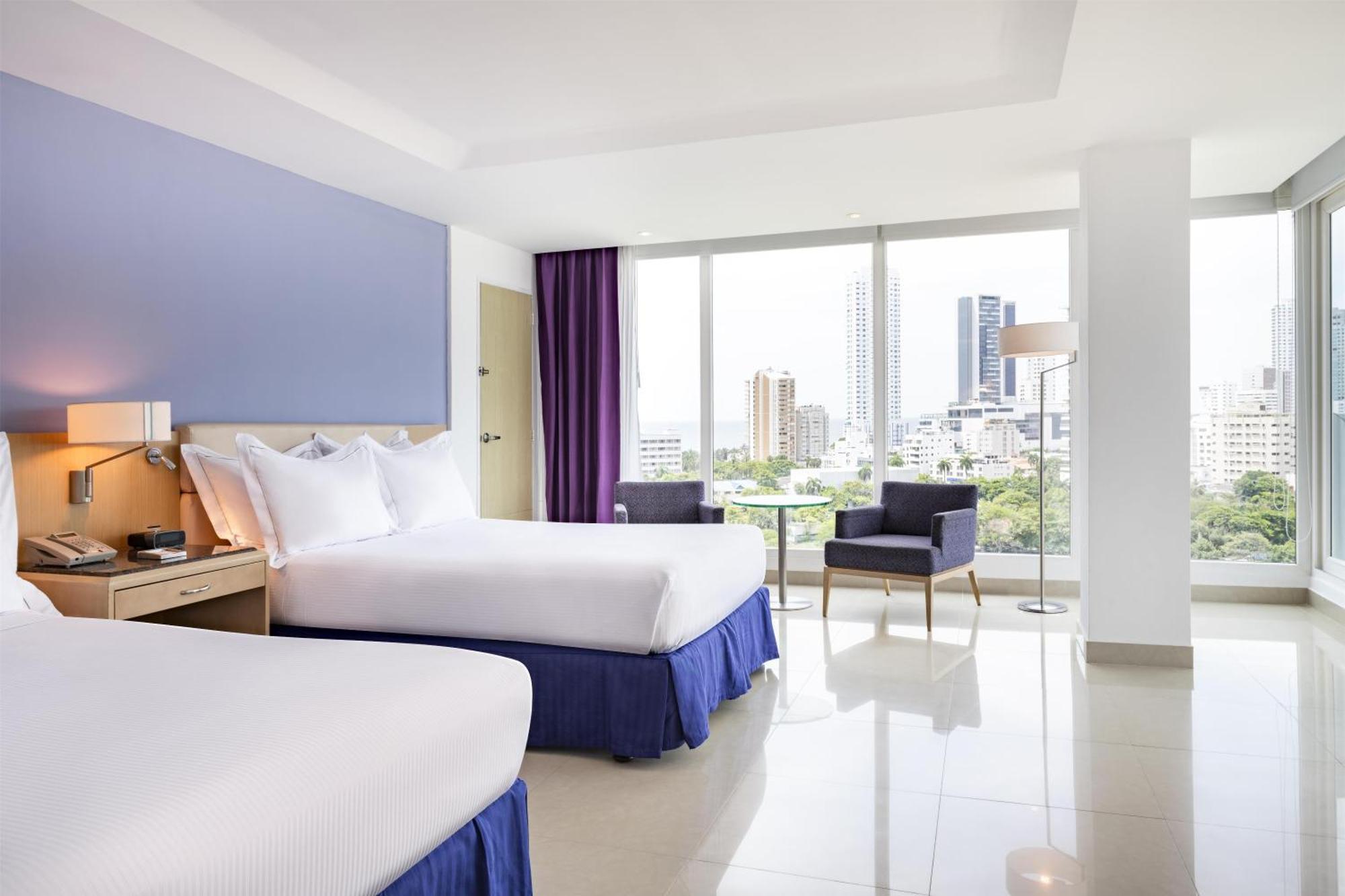 Two Queen Beds Corner Suite City or Ocean View