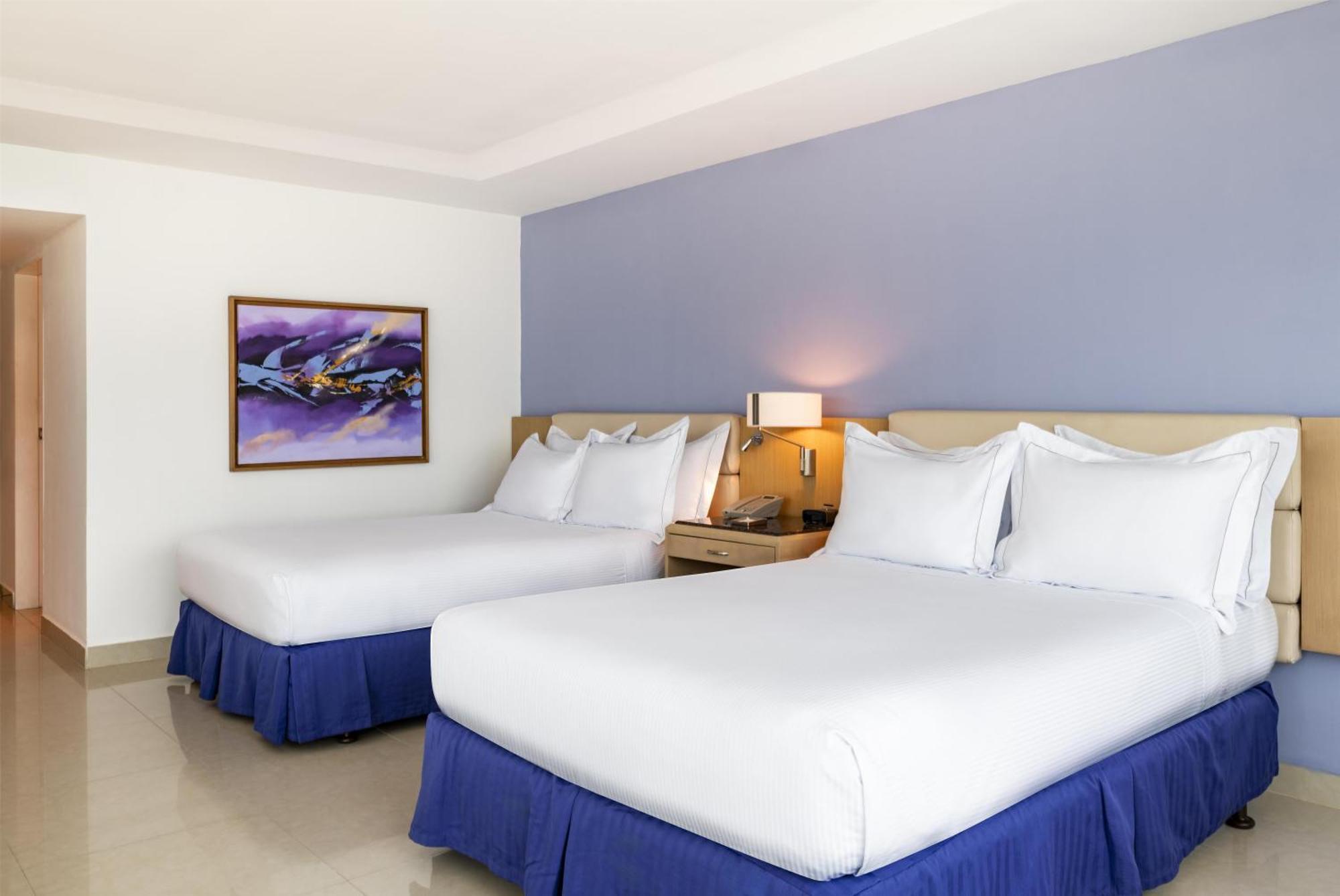 Two Queen Beds Corner Suite City or Ocean View