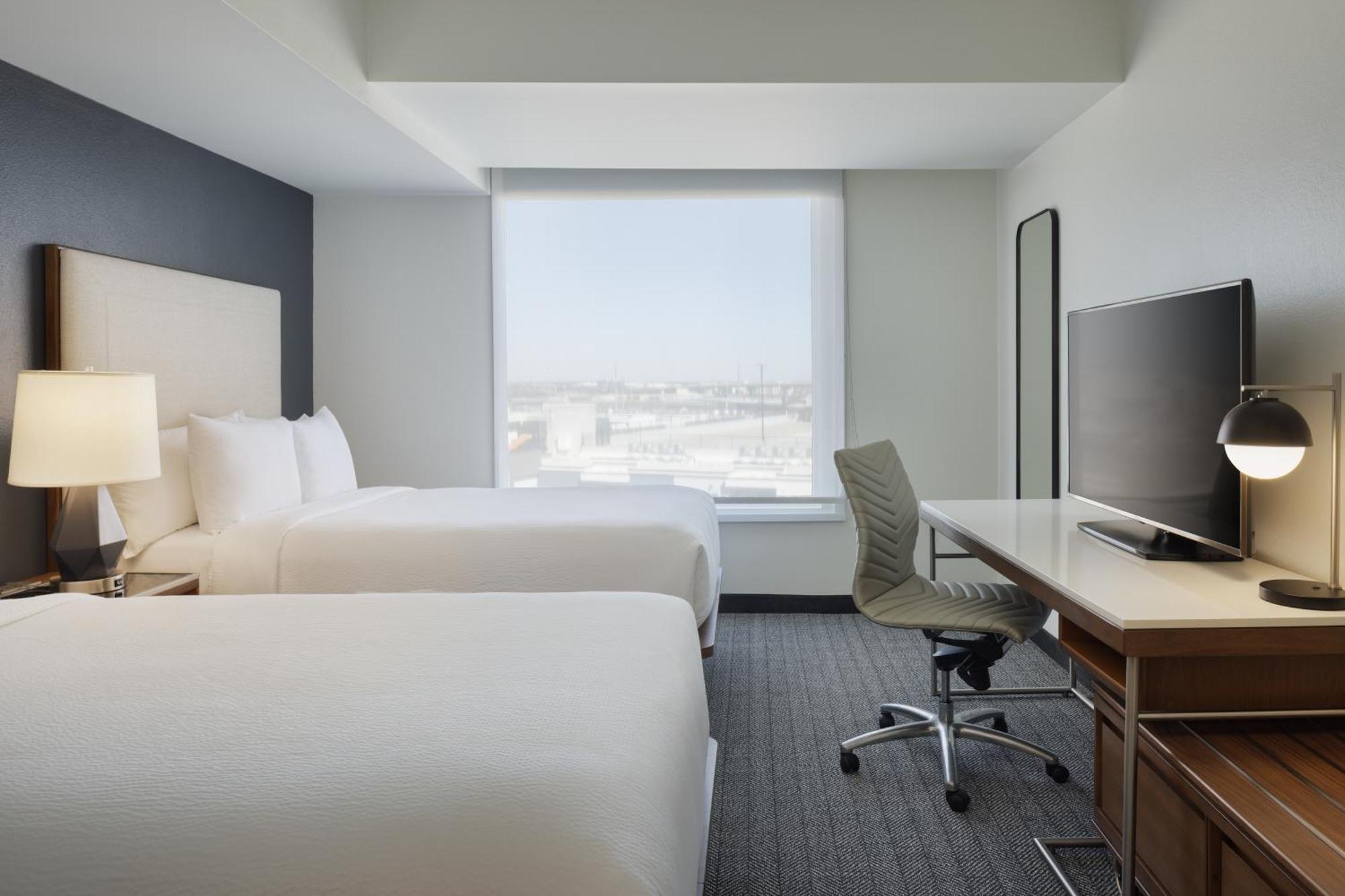 Queen Room with Two Queen Beds, Roll-In Shower and City View - Mobility and Hearing Accessible