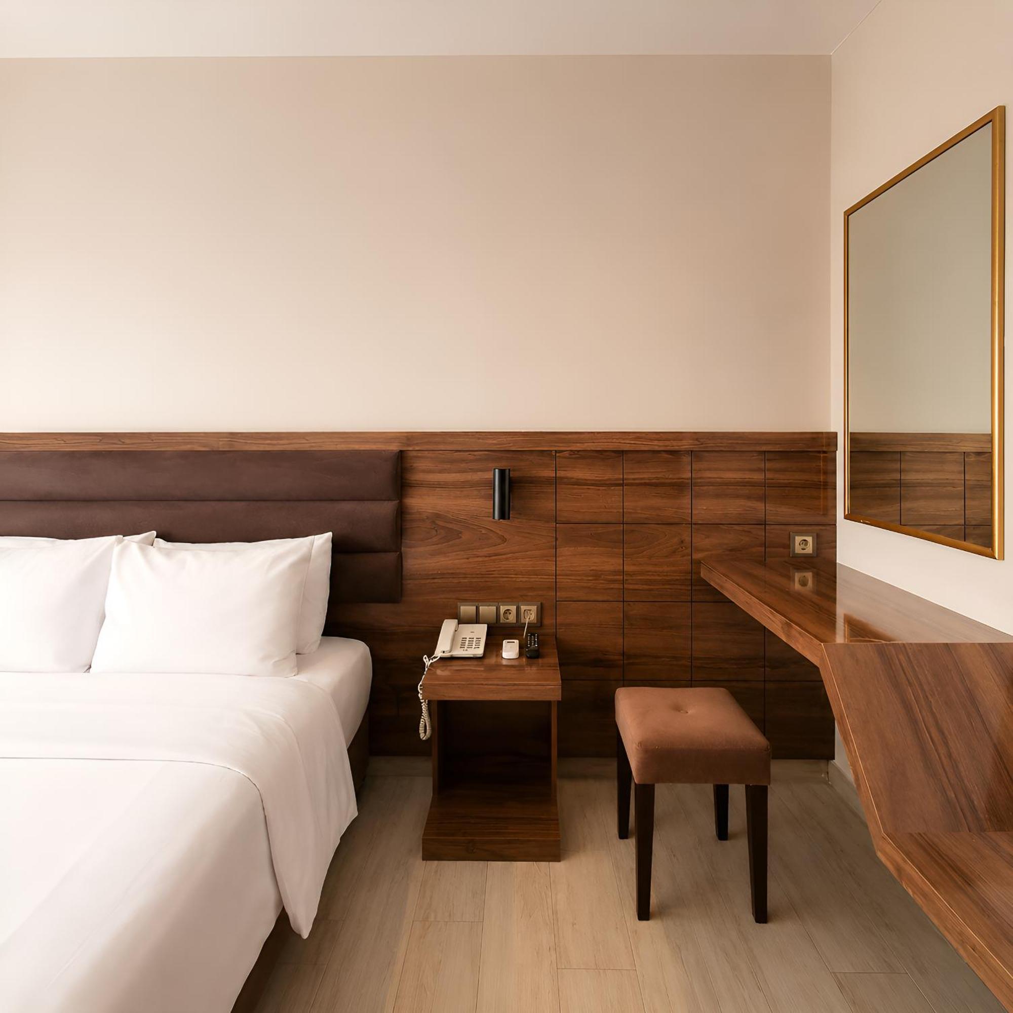 Kamer met Queensize Bed en Uitzicht op Zee