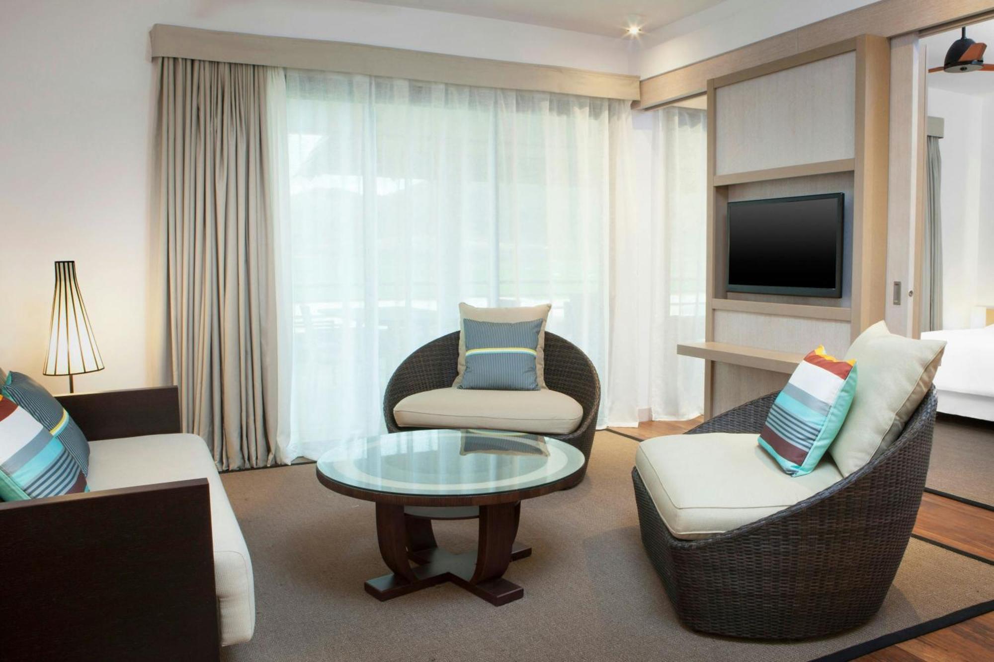 One-Bedroom King Suite with Balcony and Garden View