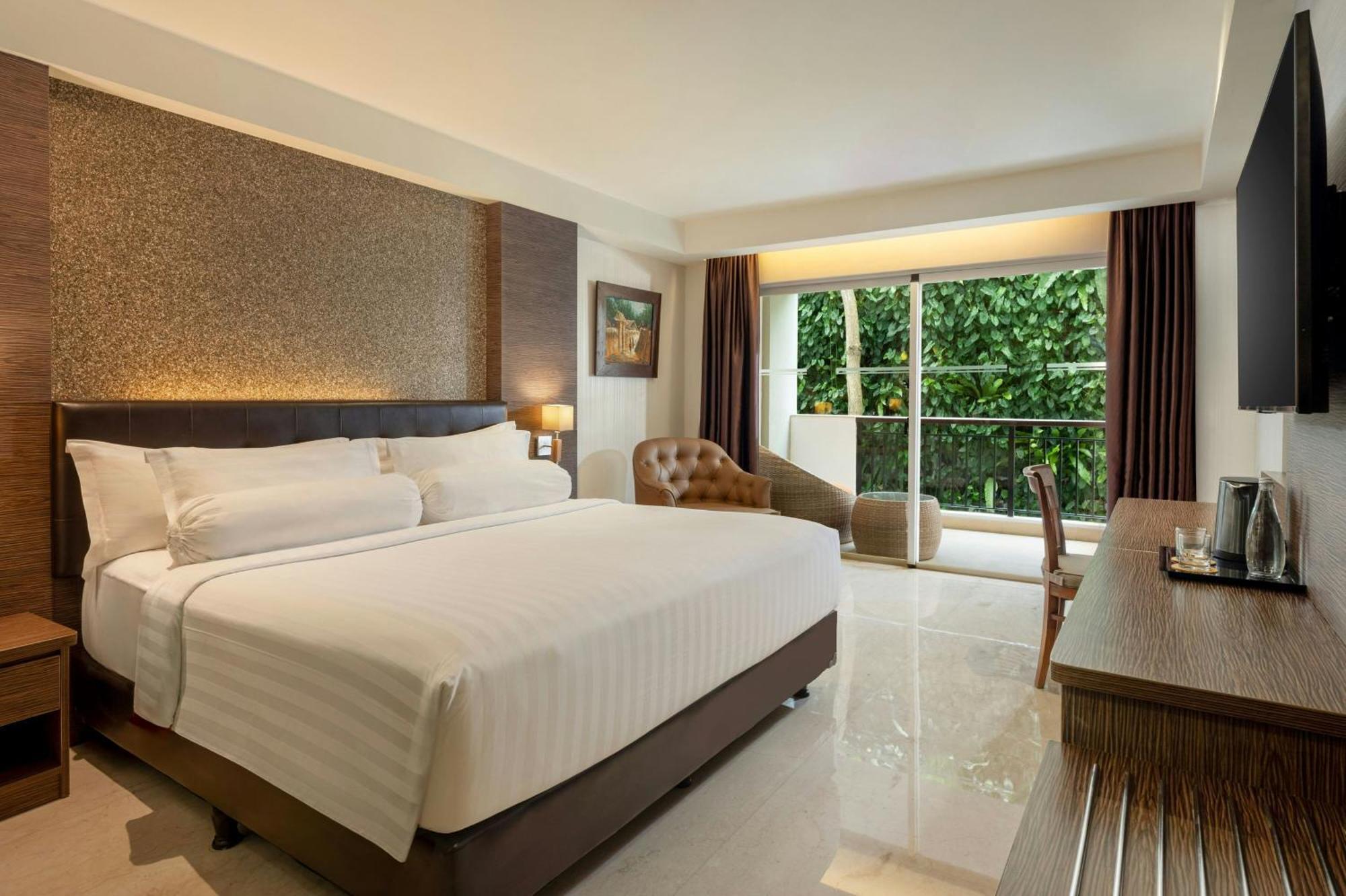 Deluxe King Balcony Room with Vertical Garden View, with FREE daily shuttle to Ubud City, FREE Photo Session, FREE Art Gallery Visit, 24-hour access to Fitness Center, FREE Welcome Drink, and FREE Kids Activities.