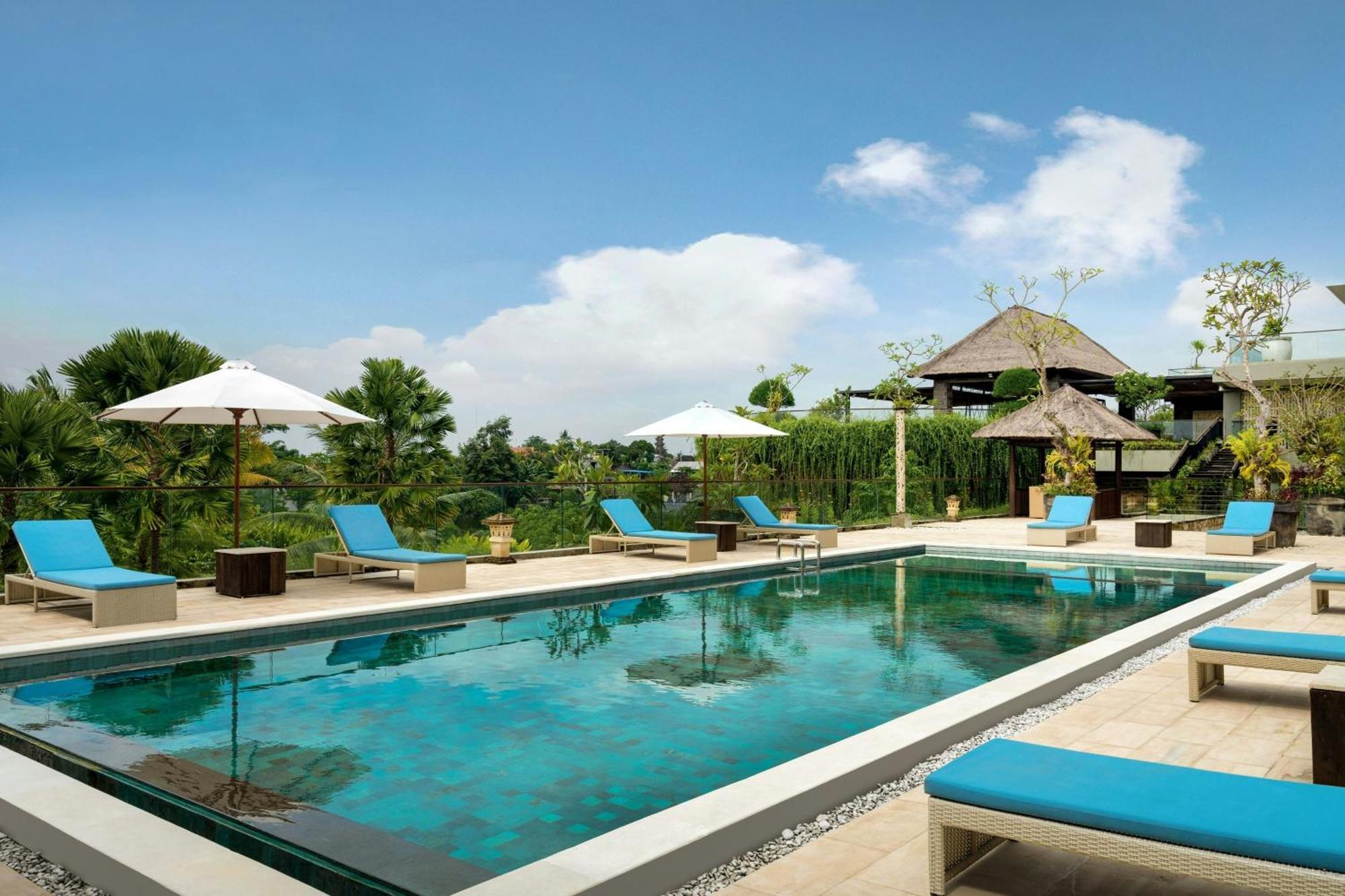 Deluxe Twin Balcony Room with Pool View, with FREE daily shuttle to Ubud City, FREE Photo Session, FREE Art Gallery Visit, 24-hour access to Fitness Center, FREE Welcome Drink, and FREE Kids Activities.