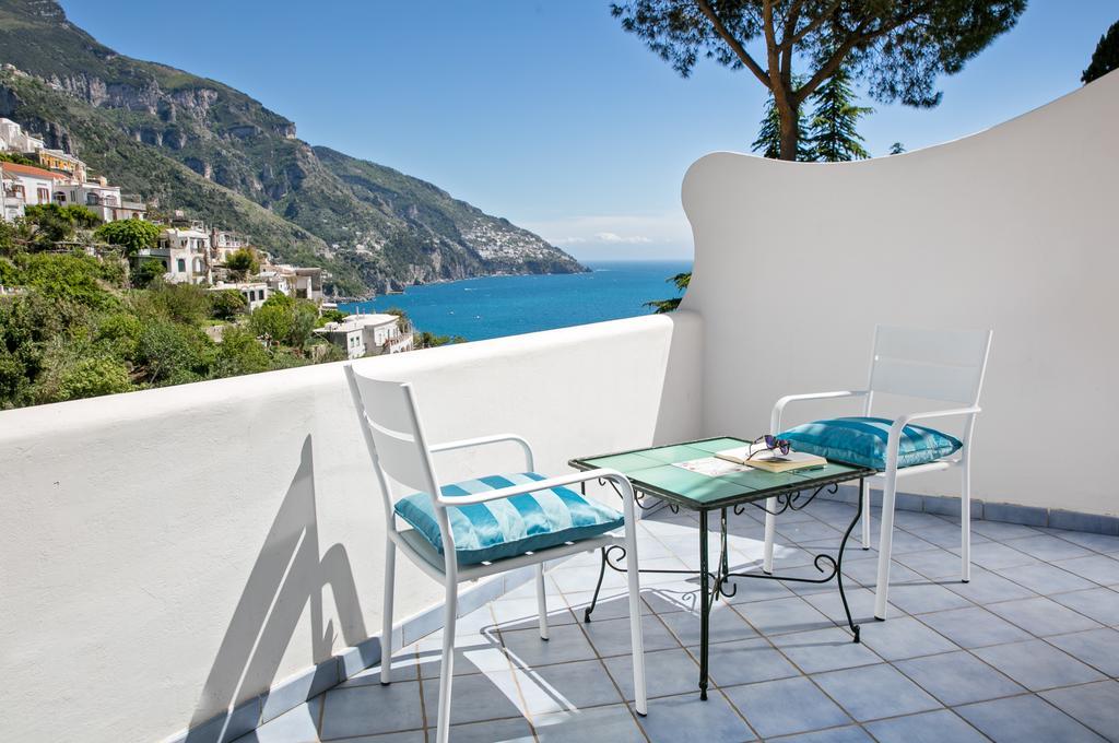 Habitación Triple Confort con vistas parciales al mar