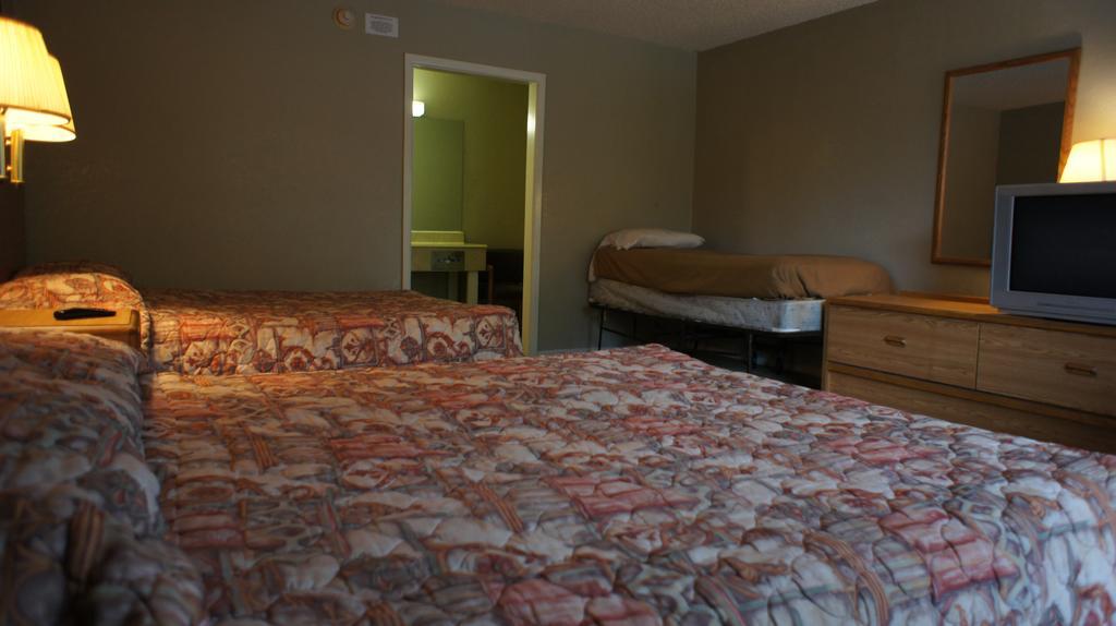 Two Double Beds with One Twin Bed