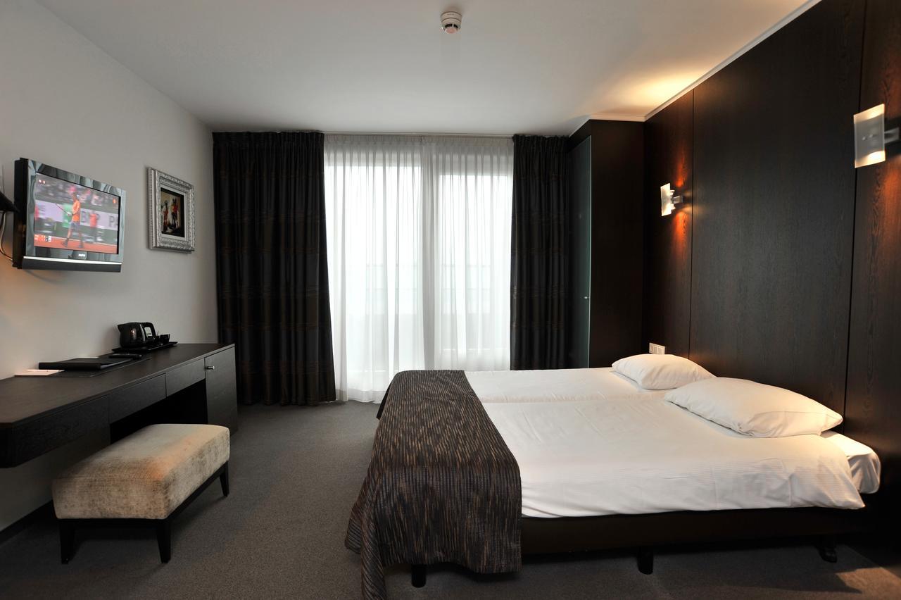 Junior Suite met 2 Eenpersoonsbedden en 1 Slaapbank