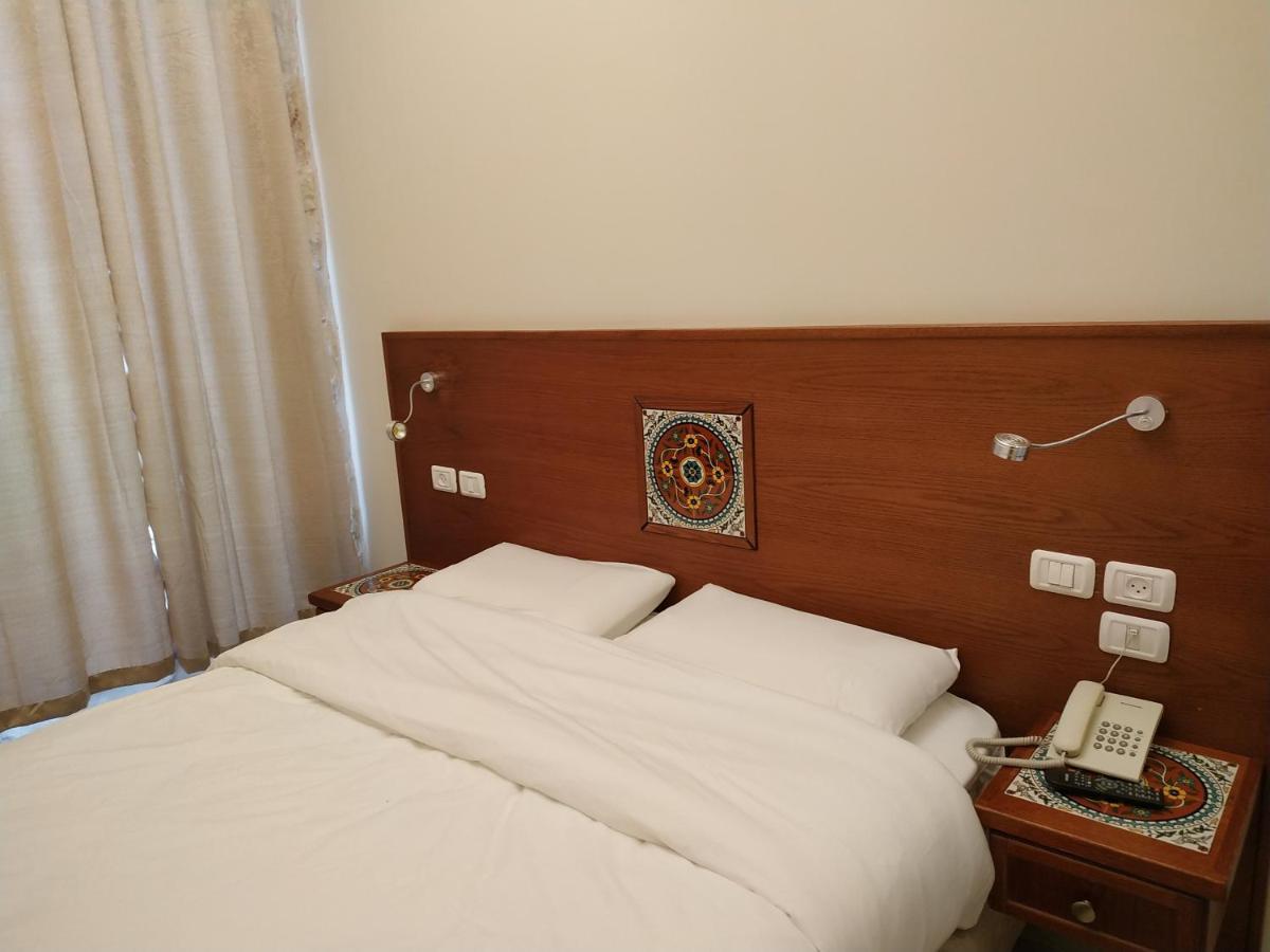 Two-Bedroom Suite with Balcony (1 Double Bed + 2 Single Beds)